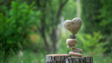 Stack of rocks with heart-shaped rock on top