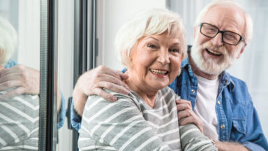 couple with woman smiling at camera