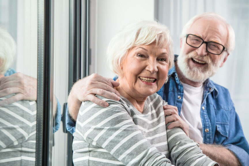 couple with woman smiling at camera