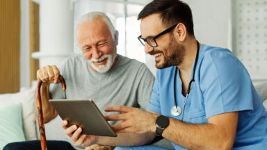 nurse showing patient ipad