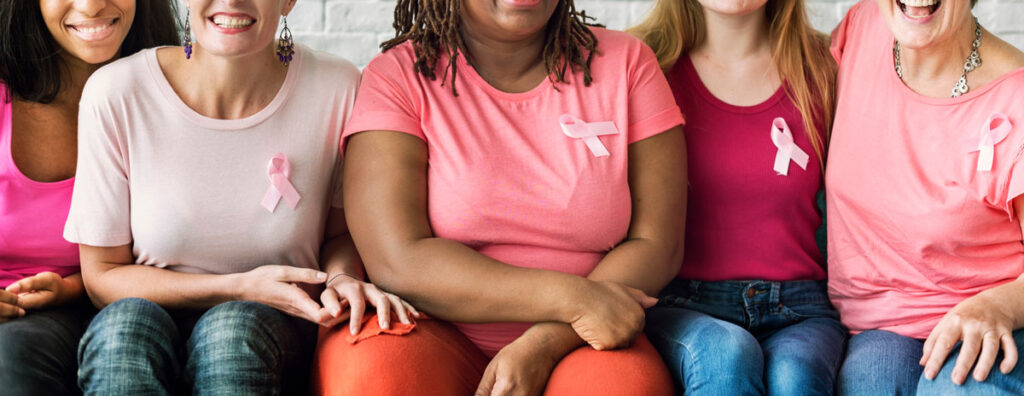 breast cancer awareness pink ribbons on group of women