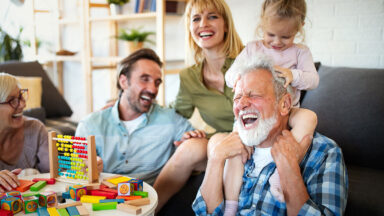 grandfather with granddaughter and parents