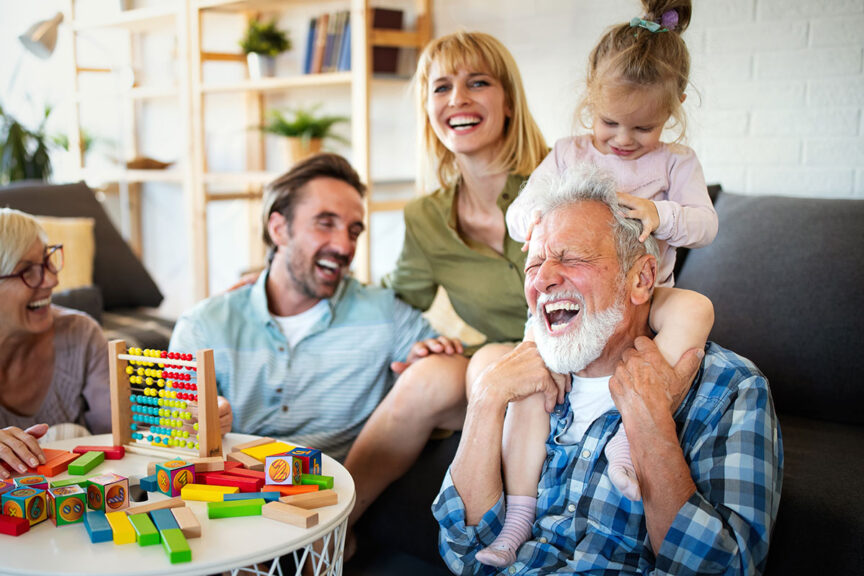 grandfather with granddaughter and parents