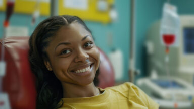 woman smiling during infusion treatment