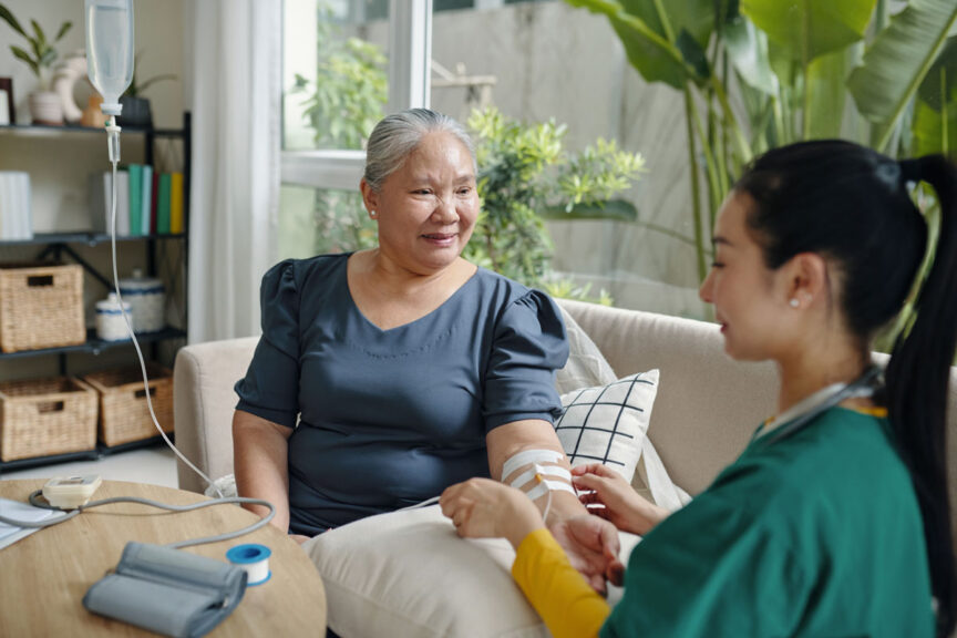 home infusion with woman and nurse