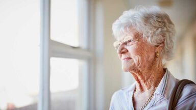Woman with Alzheimers looking out the window
