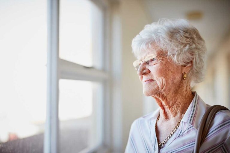 Woman with Alzheimers looking out the window