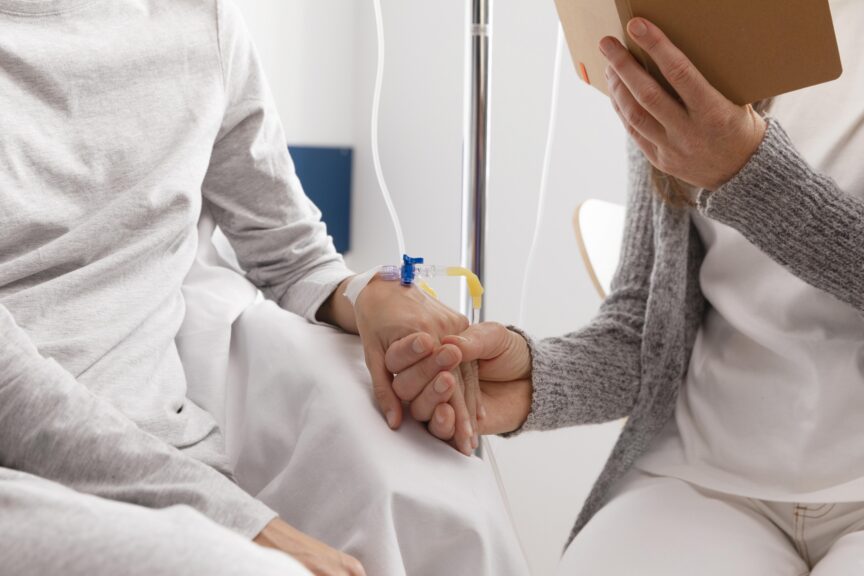 Patient receiving IV infusion therapy with supportive care during autoimmune disease treatment.