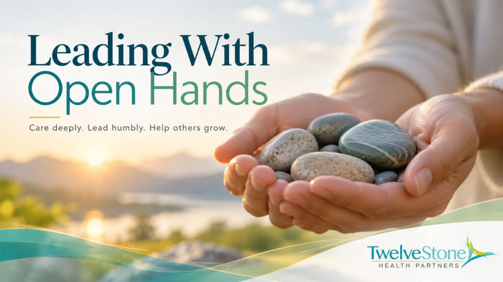 open hands holding stones